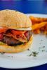 Stuffed Cheese Burger topped with Bacon and Fries